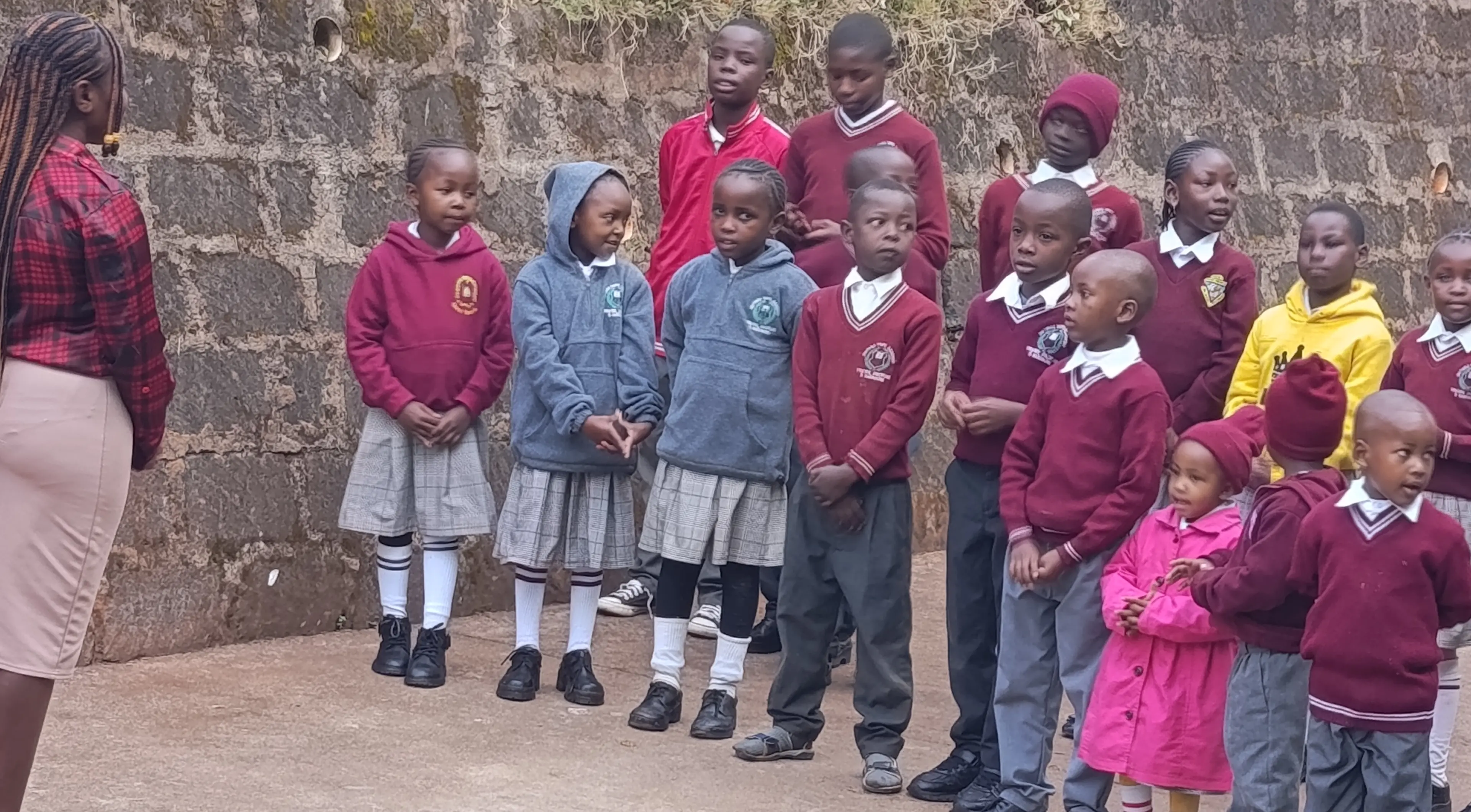 Group of school children in a photo wearing their uniforms