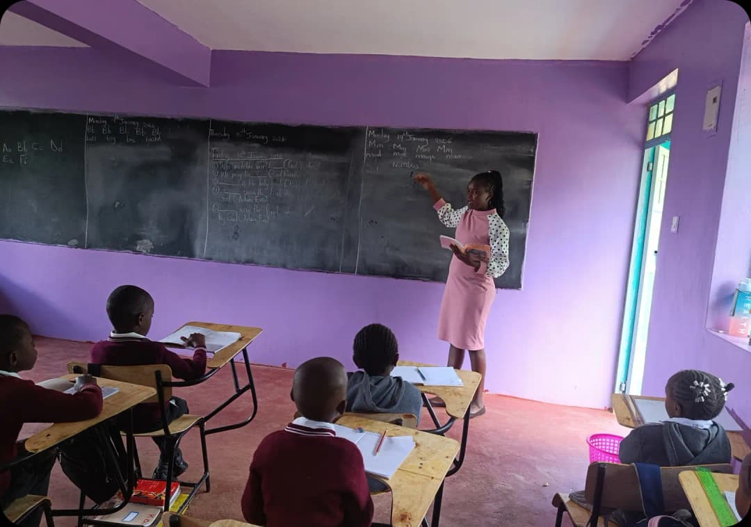 A female teacher in classroom with students