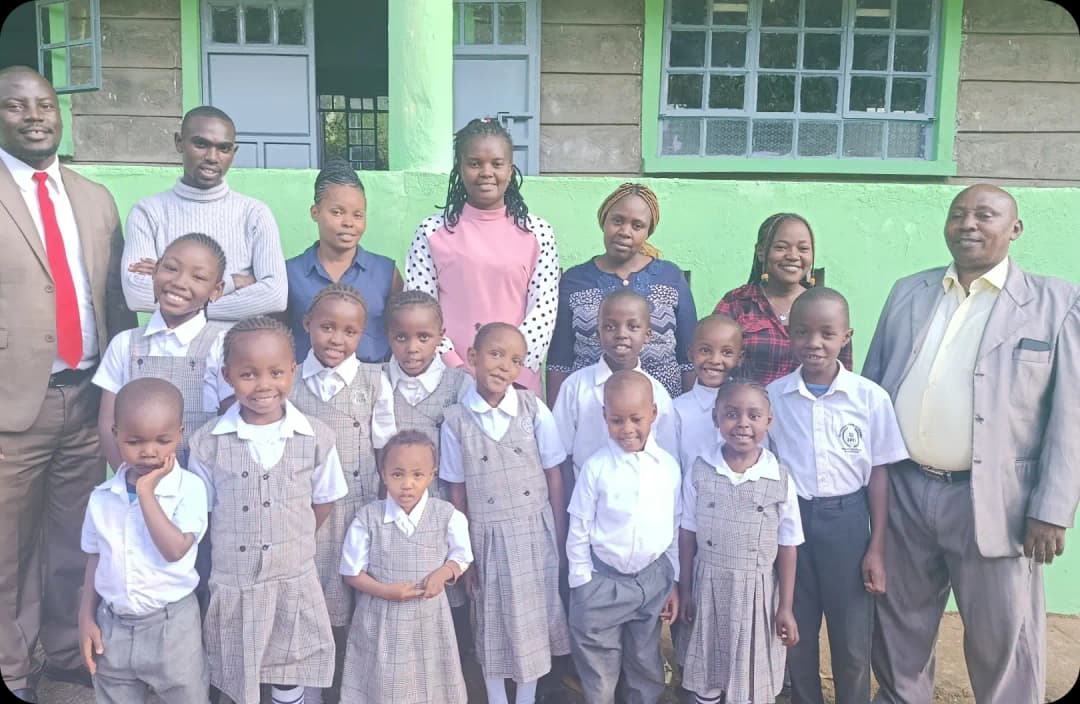 A group of teachers gathered together in a photo