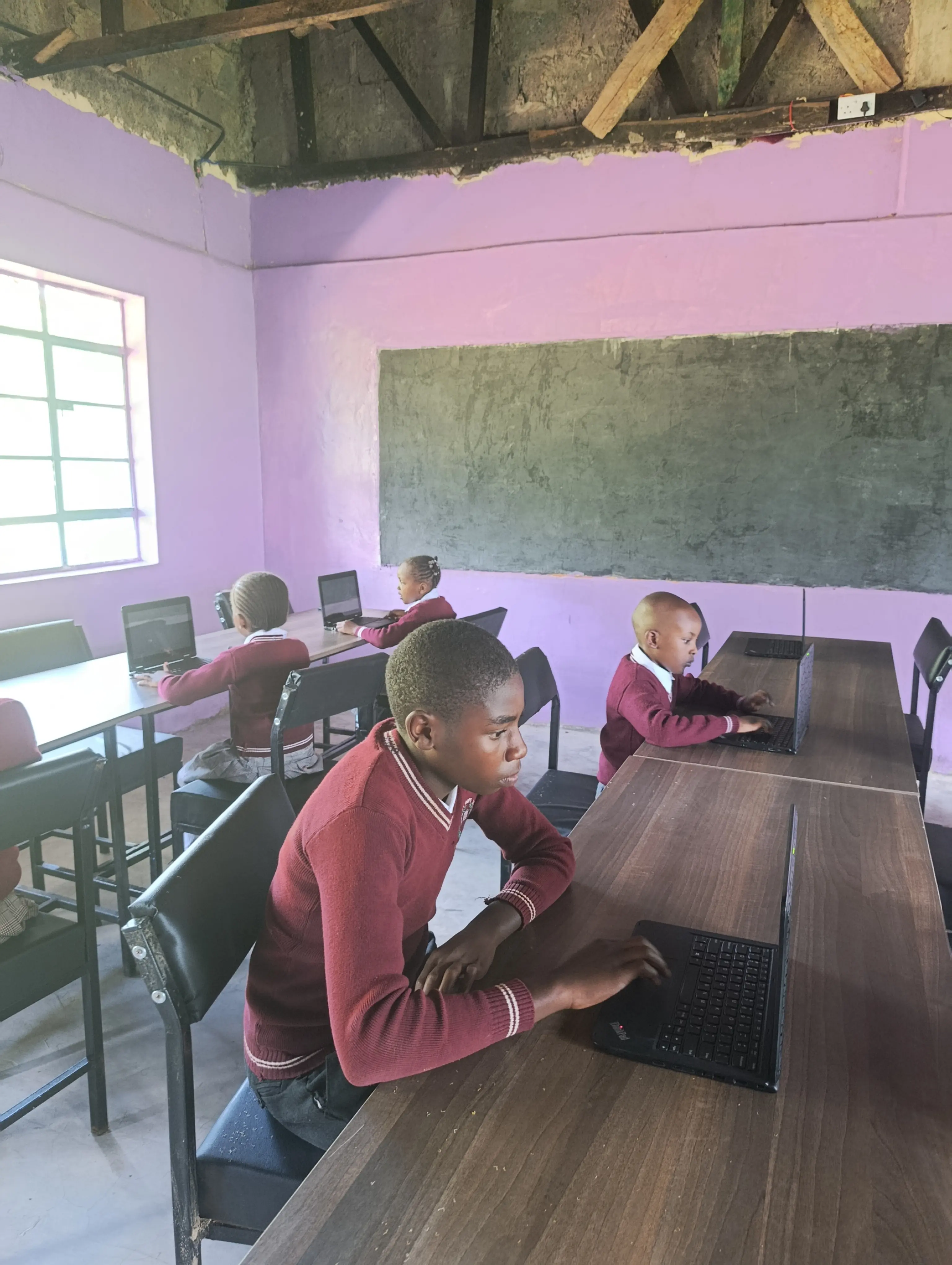 Group of school children in a photo wearing their uniforms